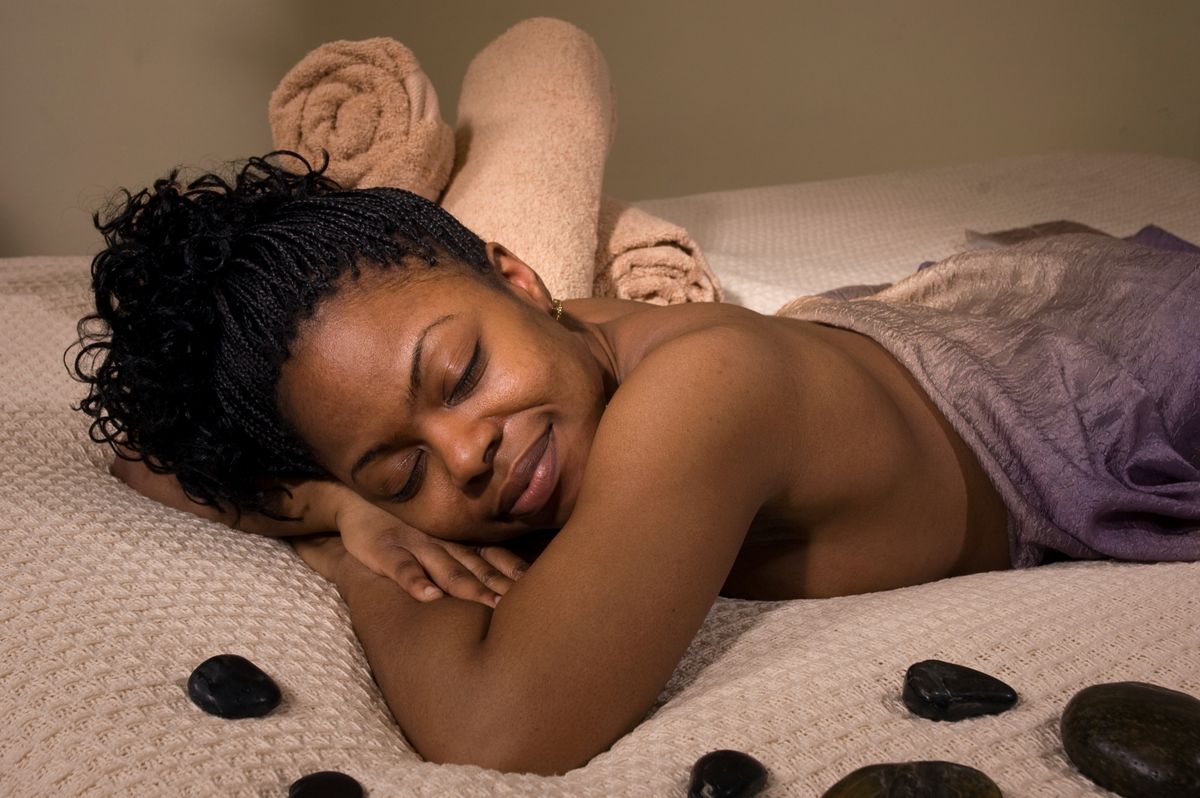 Guest relaxing with hot stones
